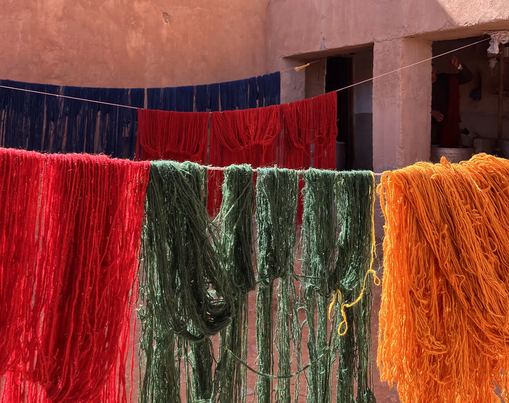 http://Hank%20of%20yarns%20freshly%20dyed%20hanging%20to%20dry